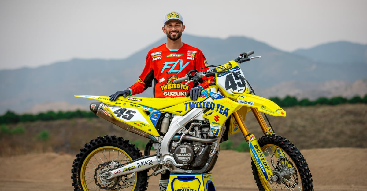 Colt Nichols poses for a photo in a picture with his HEP Motorsports Suzuki.