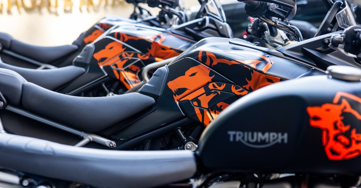 Triumph motorcycles lined up at a Call of Duty event