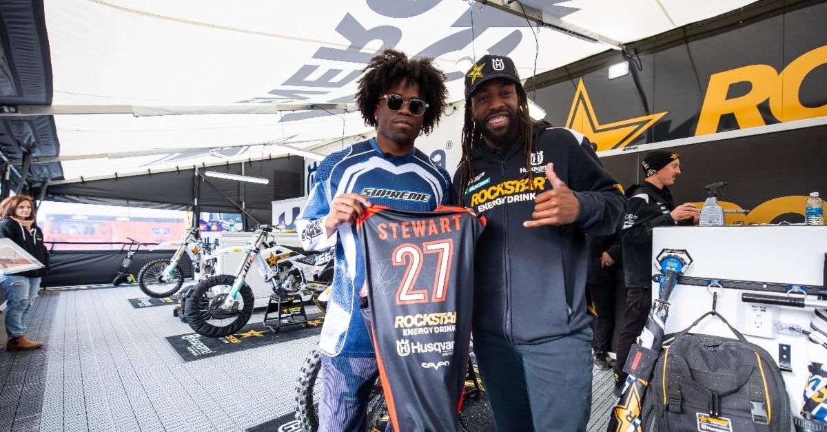 Kenny Moore II visiting with Malcolm Stewart at Round 13 at Gillette Stadium in Foxborough, Mass. last year.